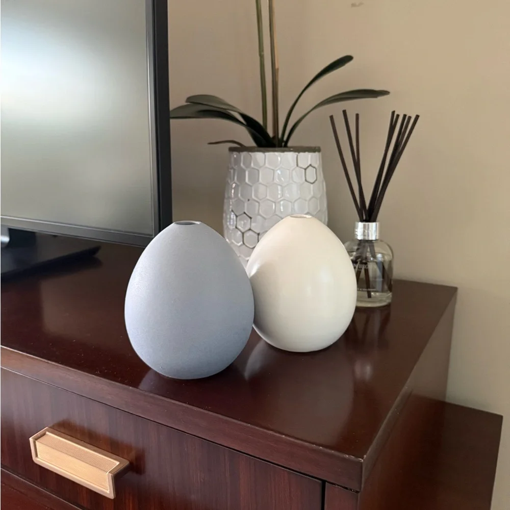 West Elm Light Blue and Ivory ceramic vase set.